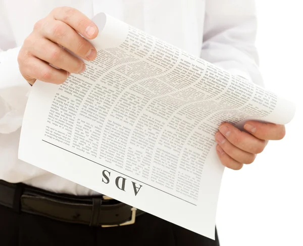 stock image Man reading ads from the paper
