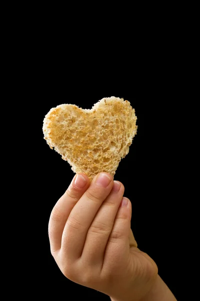 A piece of bread given with love — Stock Photo, Image