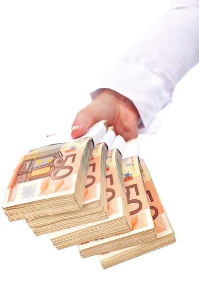 Stacks of euros in woman hand - isolated — Stock Photo, Image