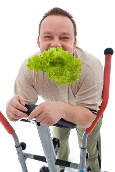 Concepto de poder adelgazante - el hombre haciendo ejercicio y comiendo sano —  Fotos de Stock