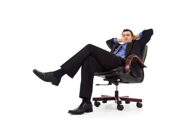 Бизнесмен отдыхает в кресле — стоковое фото