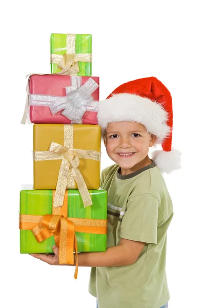 Szczęśliwy chłopiec na Boże Narodzenie z dużą ilością prezentów — Zdjęcie stockowe