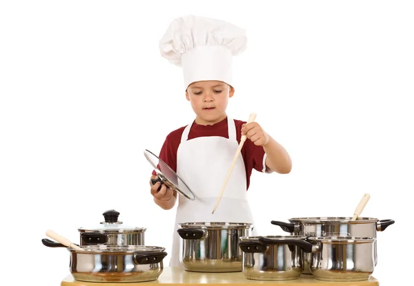Young chef preparing a meal — Stock Photo, Image