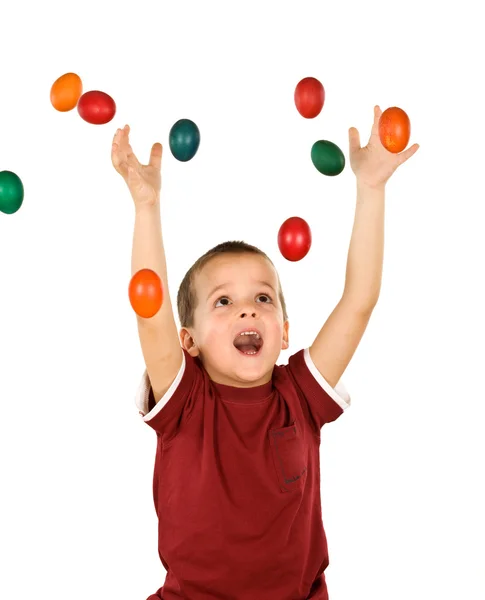 Little boy with falling easter eggs - isolated — Stock Photo, Image