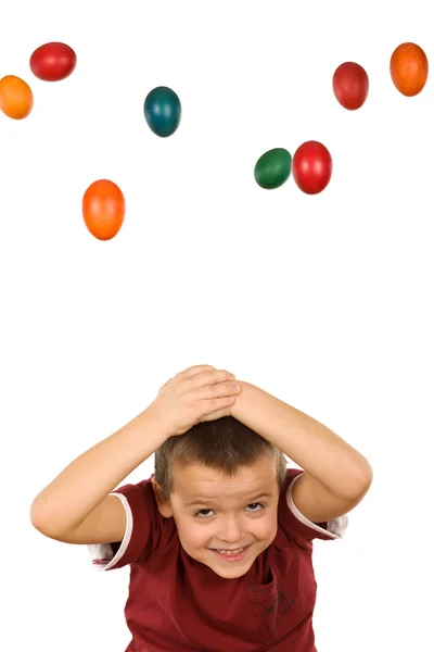 Boy with falling easter eggs — Stock Photo, Image