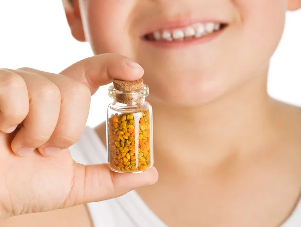 Little boy holding small bottle of pollen — Stock Photo, Image