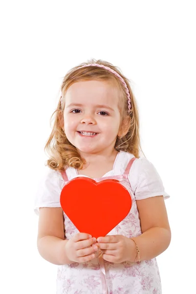 快乐微笑的小女孩用红色的心 — 图库照片