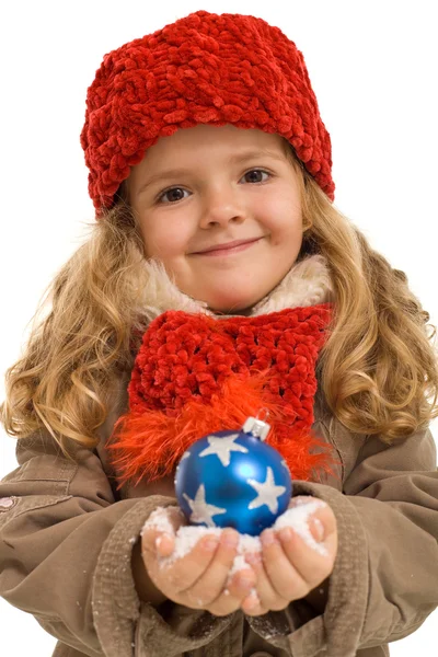 Little girl in warm clothes holding blue christmas ball — Stock Photo, Image