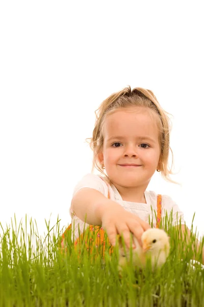 Little girl catching the small Easter chicken — Stock Photo, Image