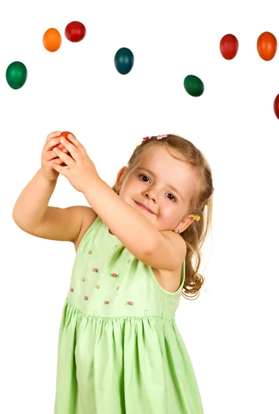 Little girl catching the easter eggs — Stock Photo, Image