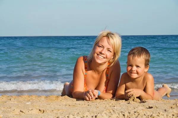 Mother and son on the beach — Stock Photo, Image