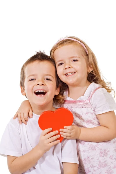 Happy kids with red heart — Stock Photo, Image