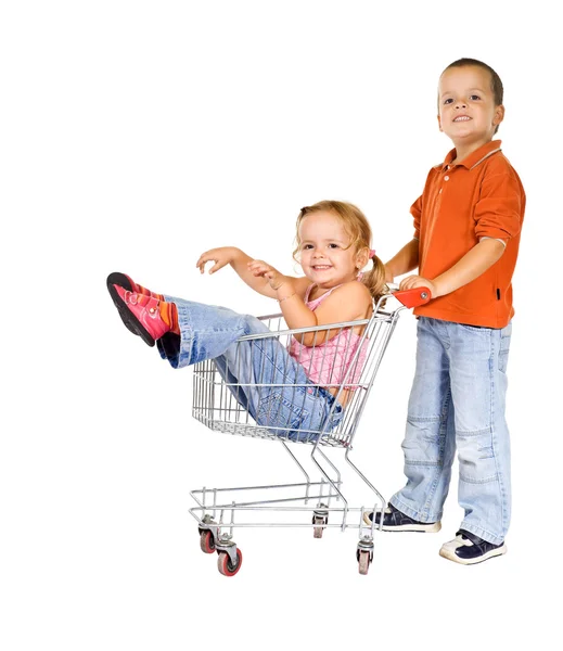 Laughing kids with shopping cart — Stock Photo, Image