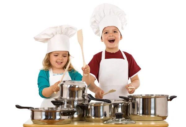 Happy kids dressed as chefs making noise — Stock Photo, Image