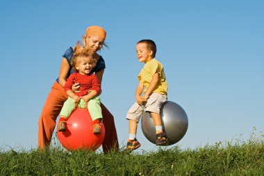 Family jumping on grass clipart