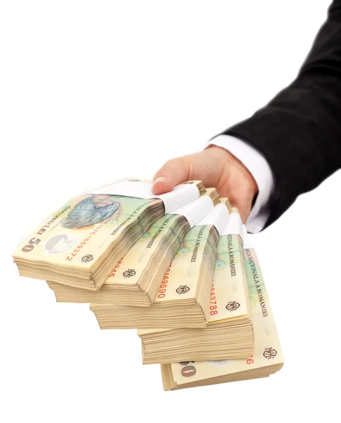 Hand som håller stack av rumänska valuta — Stockfoto
