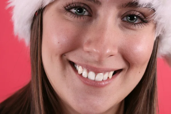 Mujer linda en sombrero de Navidad borrosa — Foto de Stock
