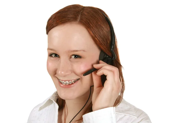 Feliz joven representante de servicio al cliente en auriculares — Foto de Stock