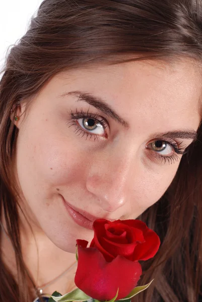 Young girl smelling a rose — Stock Photo, Image