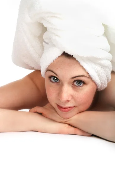 Girl laying in a towel Royalty Free Stock Photos