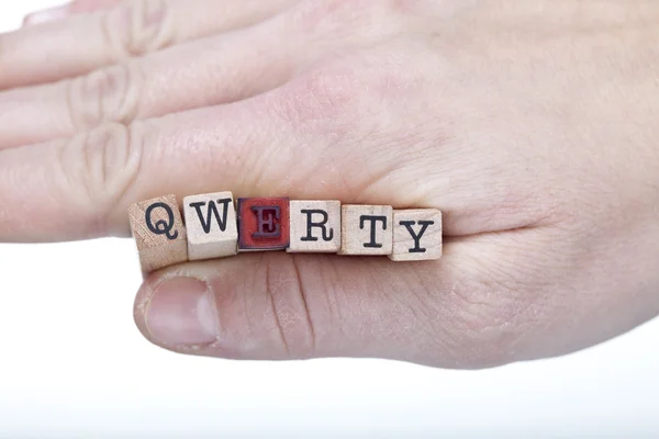 Mão com letras QWERTY — Fotografia de Stock