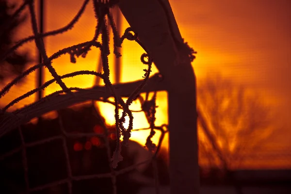 Футбол и закат — стоковое фото