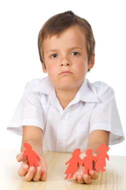 Sad kid with paper in hands - divorce concept clipart