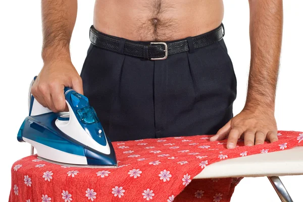 stock image Man in trousers ironing