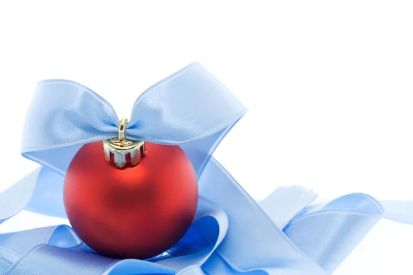 Red christmas decoration with soft blue ribbon — Stock Photo, Image