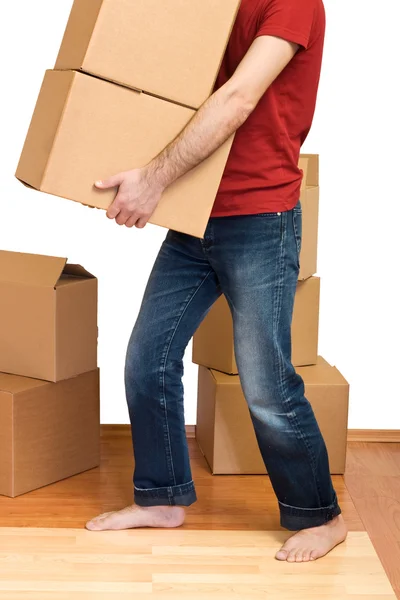 Людина з великою кількістю картонних коробок — стокове фото