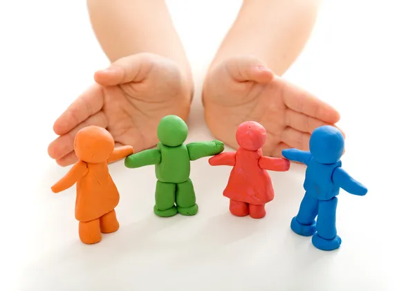 Child hands protecting clay — Stock Photo, Image