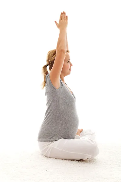 Beautiful pregnant woman doing exercises — Stock Photo, Image
