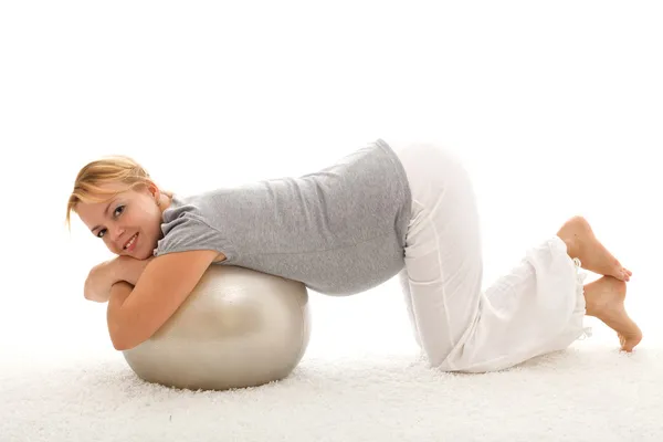 Beautiful woman exercising with large ball — Stock Photo, Image