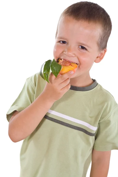 Boy with half peach — Stock Photo, Image