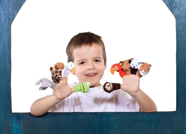Criança sorridente brincando com fantoches — Fotografia de Stock