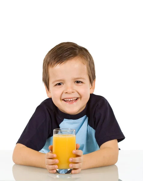 Μικρό αγόρι με ένα ποτήρι χυμό φρούτων — Φωτογραφία Αρχείου