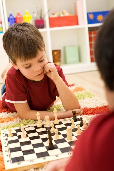Serious chess player kid — Stock Photo, Image