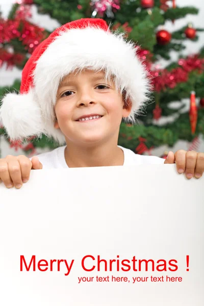Boy with banner and christmas hat — Stock Photo, Image
