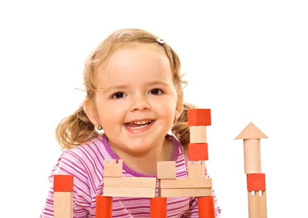 Menina feliz com blocos de madeira — Fotografia de Stock