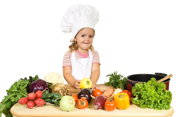 Pequeno chef feliz com legumes — Fotografia de Stock