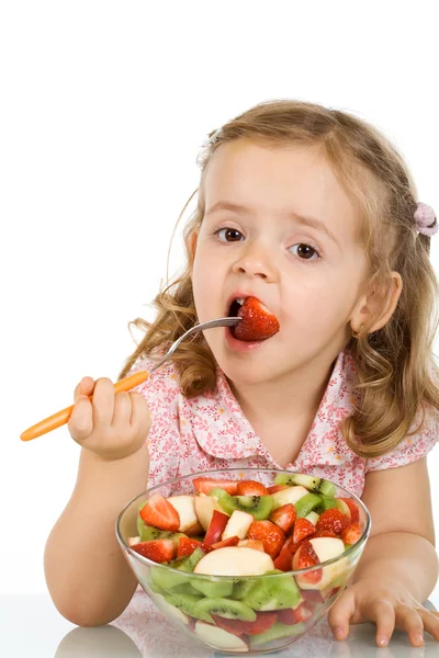 Menina comendo salada de frutas — Fotografia de Stock