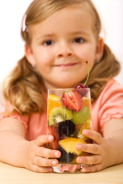 Little girl with fruit drink — Zdjęcie stockowe