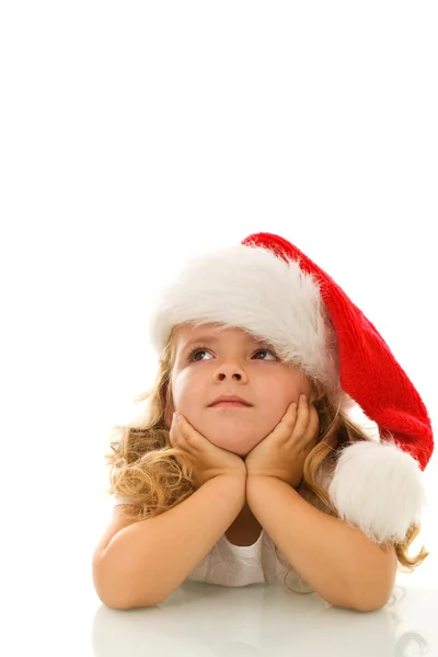 Klein meisje denken over Kerstmis — Stockfoto