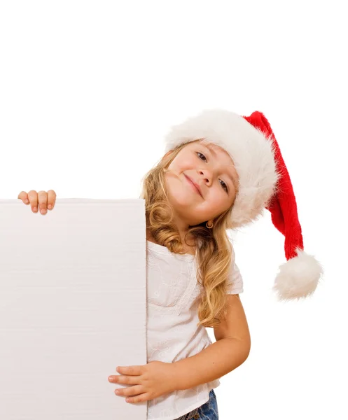 Meisje met kerst hoed en witte banner — Stockfoto