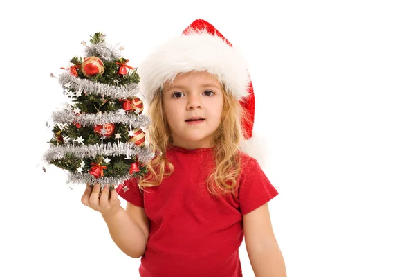 Klein meisje bedrijf kleine ingericht boom bij Kerstmis — Stockfoto