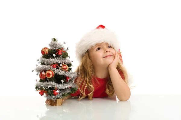 Little girl dreaming of a white christmas — Stock Photo, Image