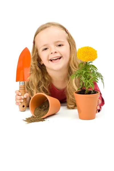 Menina feliz com flor em vaso — Fotografia de Stock