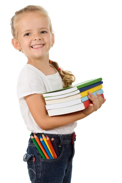 Malá holčička se spoustou knih — Stock fotografie