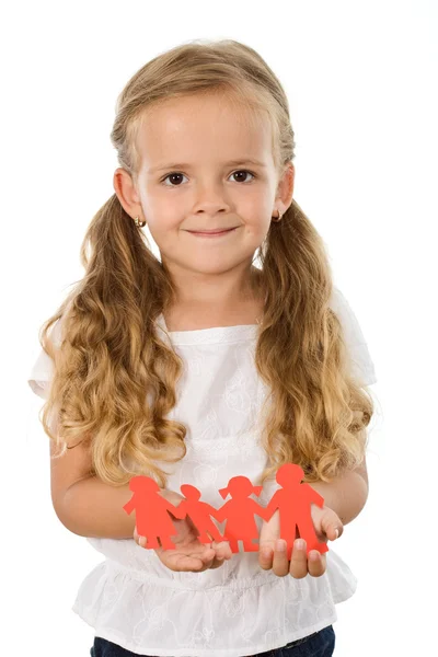 Little girl holding paper family — Stock Photo, Image