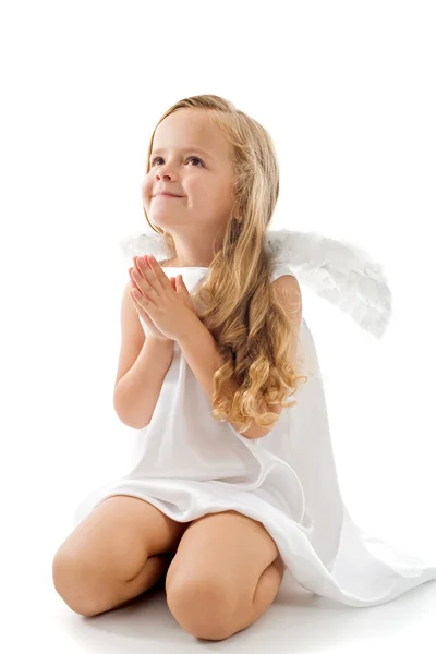 Pequeno anjo olhando para cima agradecido — Fotografia de Stock